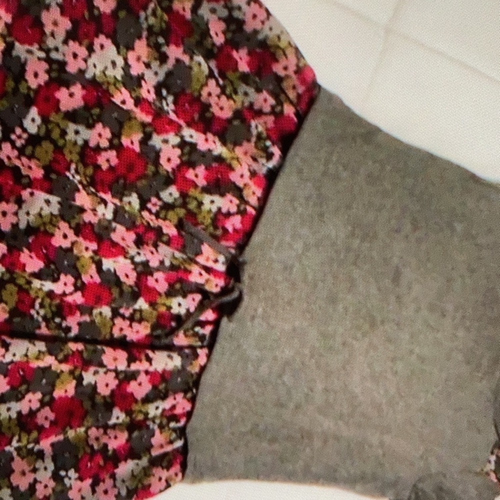 Features playful colorful floral dress